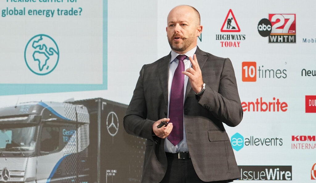 A vibrant conference organized by a leading event company in Dubai, showcasing a large, well-lit venue with attendees engaged in discussions and presentations.