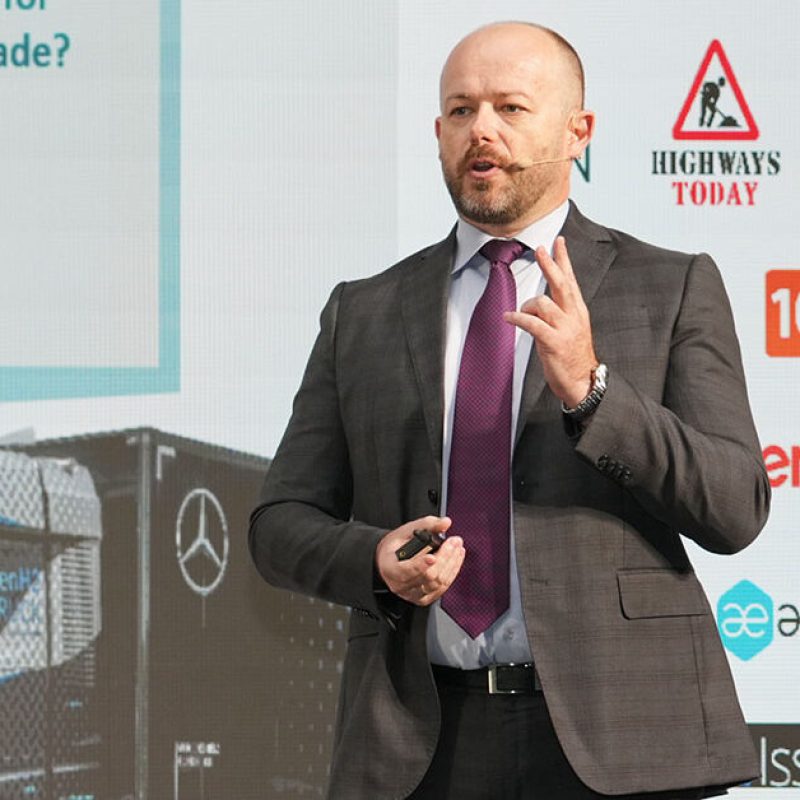 A vibrant conference organized by a leading event company in Dubai, showcasing a large, well-lit venue with attendees engaged in discussions and presentations.